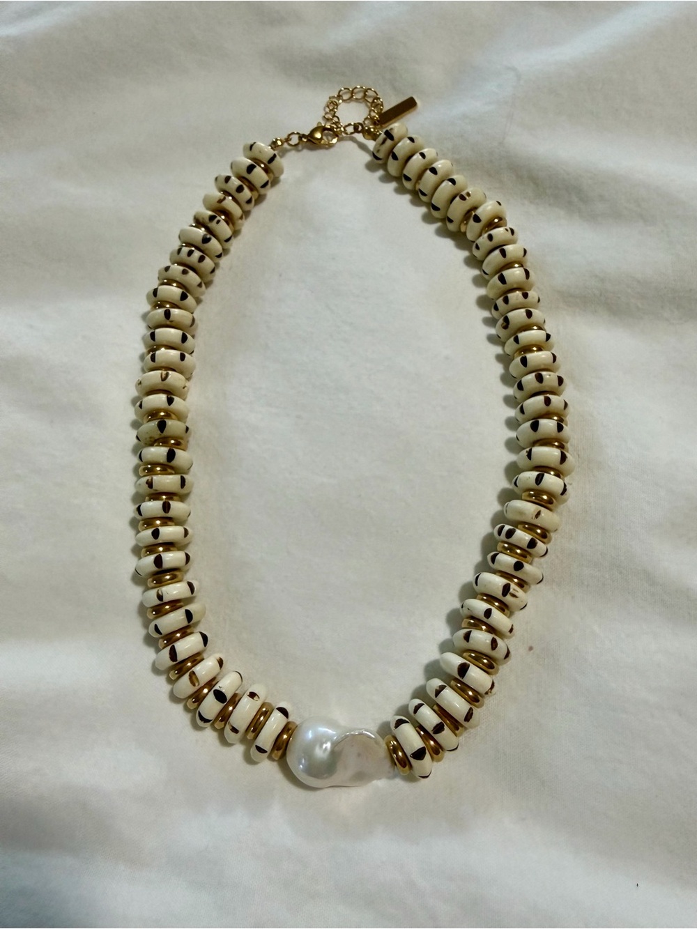 White Beaded Necklace with Gold Accents and Pearl Focal
